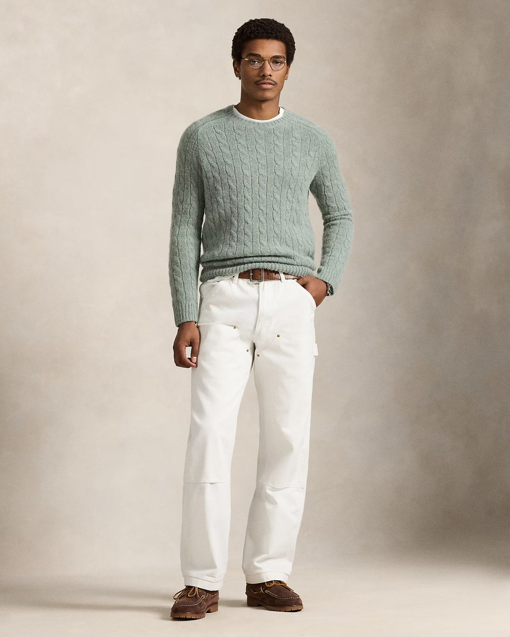 Pull torsadé à renforts en daim