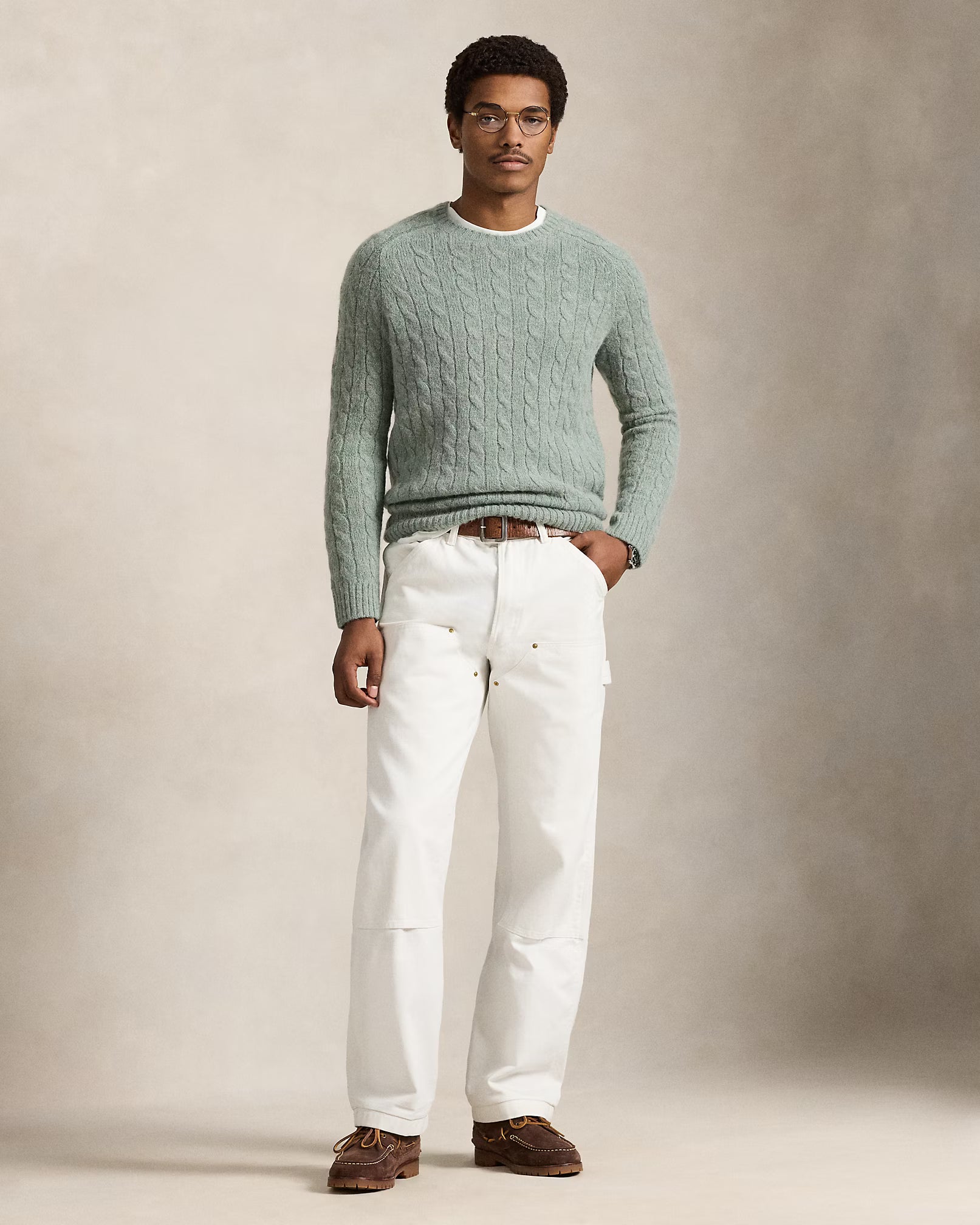 Pull torsadé à renforts en daim