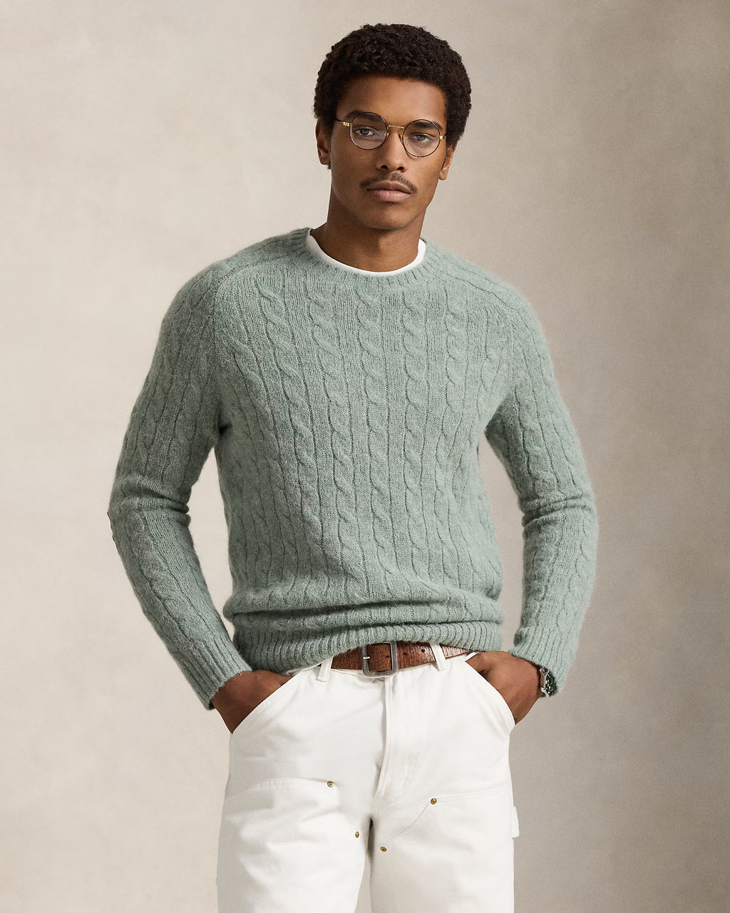 Pull torsadé à renforts en daim