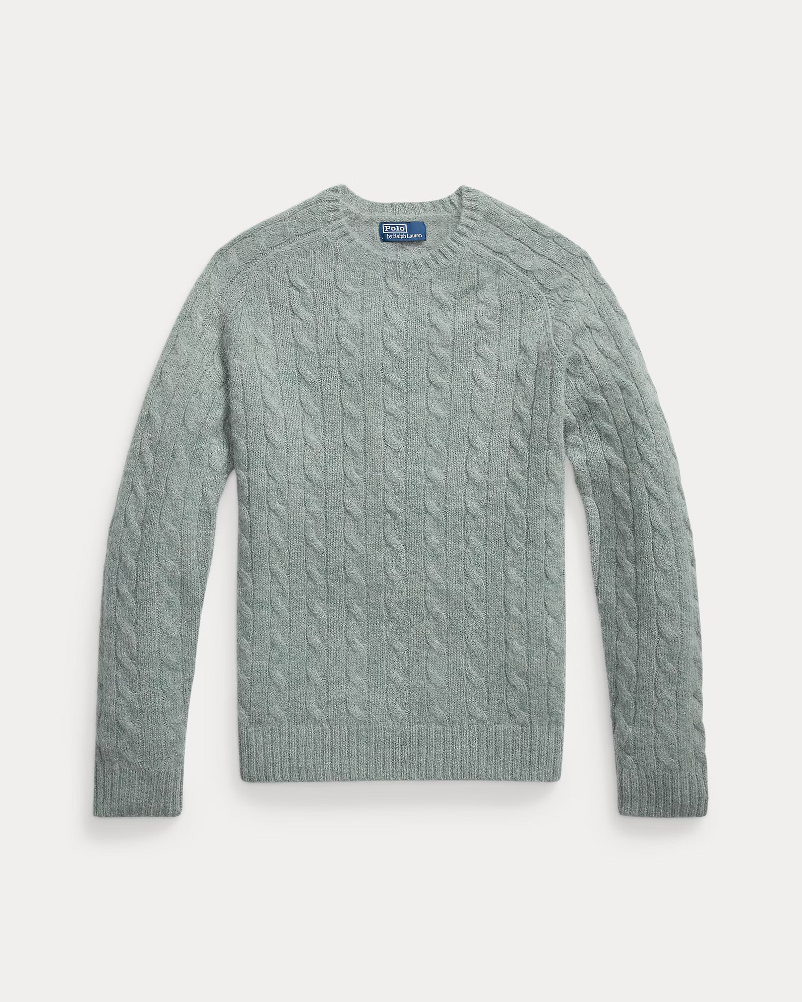 Pull torsadé à renforts en daim